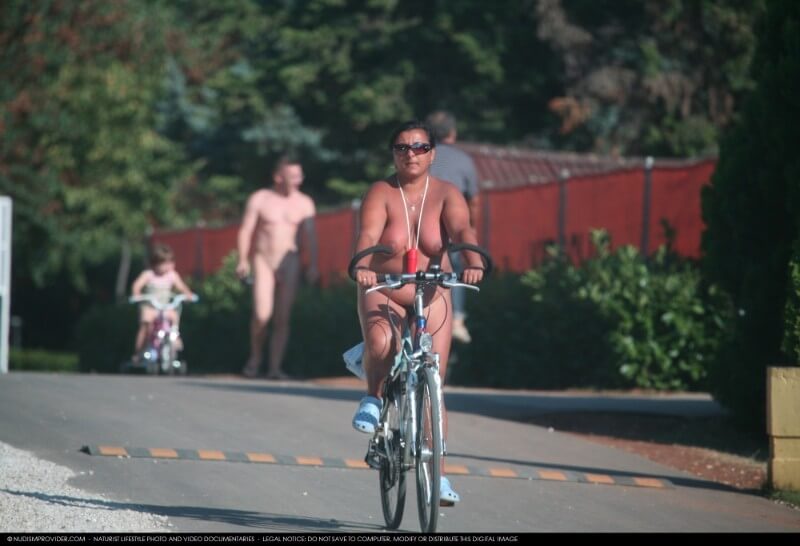 Naturists Road Biking pics - Melting under the scorching sun, I sunbathe naked