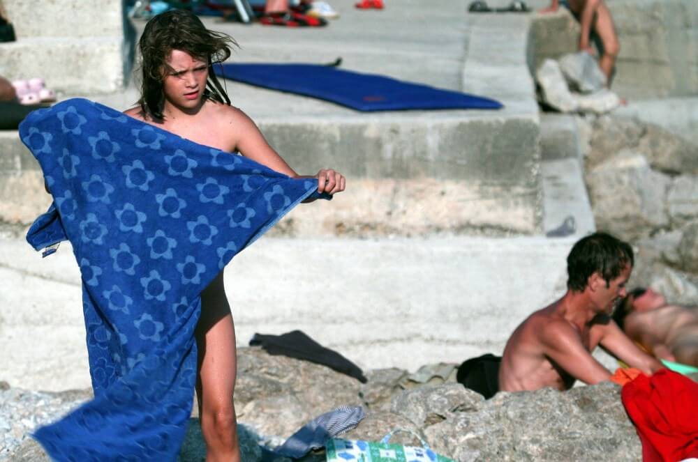 Nudist Rocky Family Angle - The practice of naturism fosters an atmosphere of trust and respect