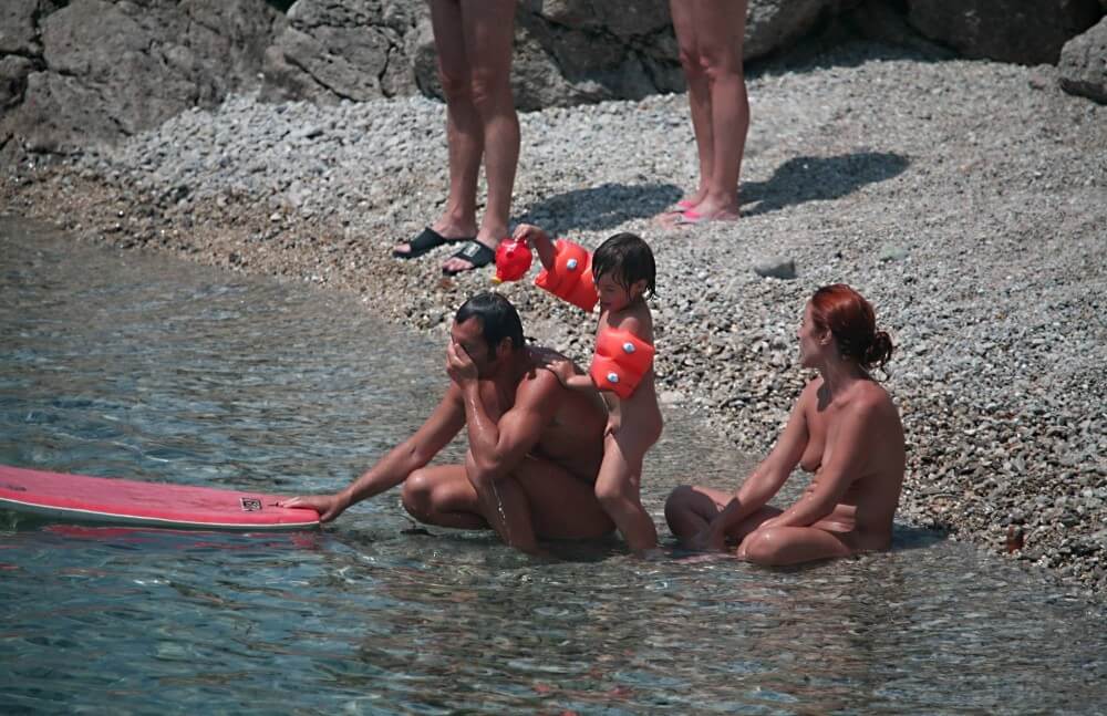 Beach Nudist Family Shore Camp pics - A defining feature of naturism is the absence of clothing