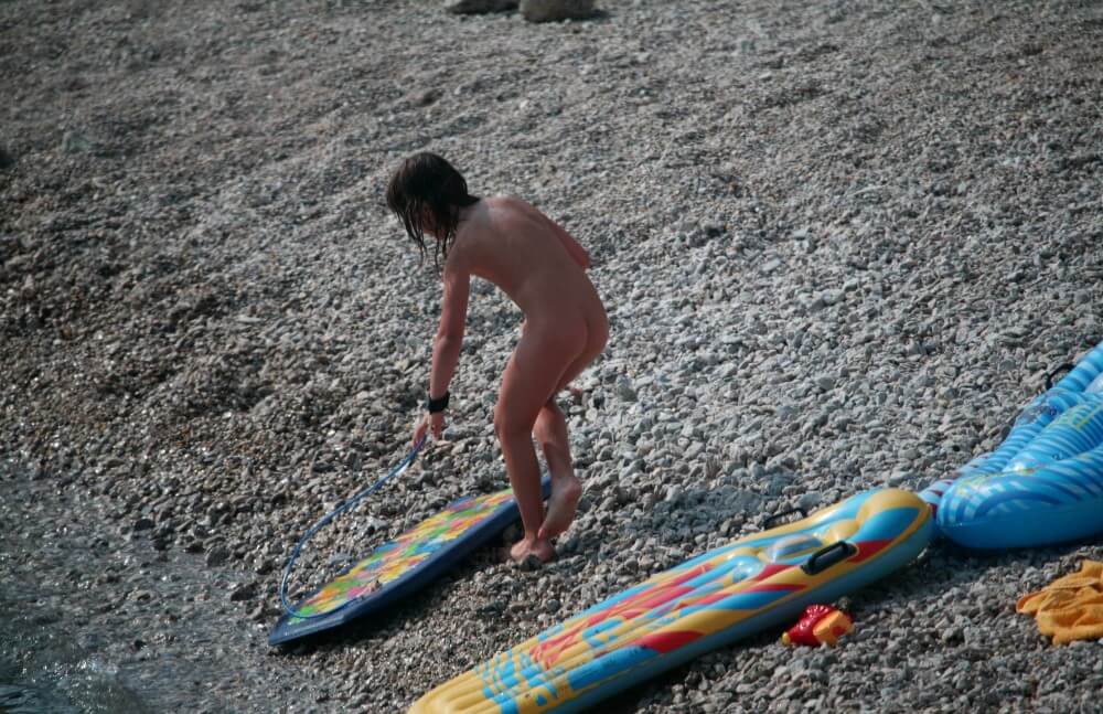 Naturist Surf Board Glides pics - Nudity is an expression of natural beauty
