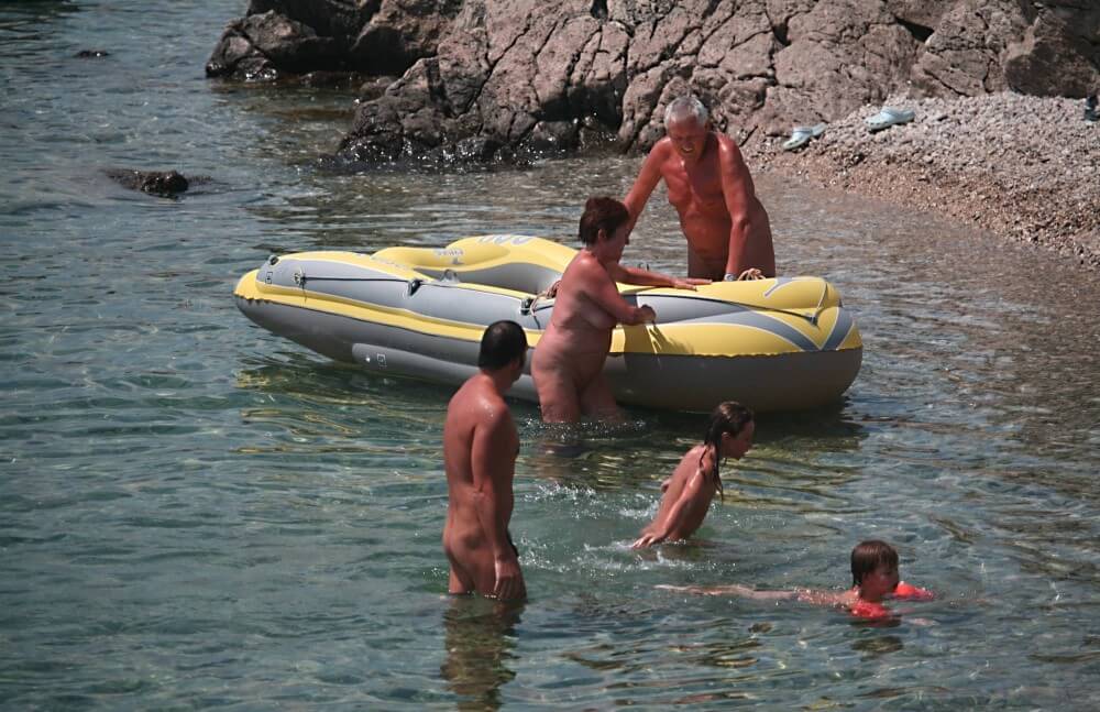 Lone Nudist in Yellow Boat photos - Nudity is a part of life without shame