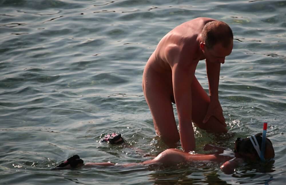Father Floats His Daughter pics - People seek unity with nature through naturist practices